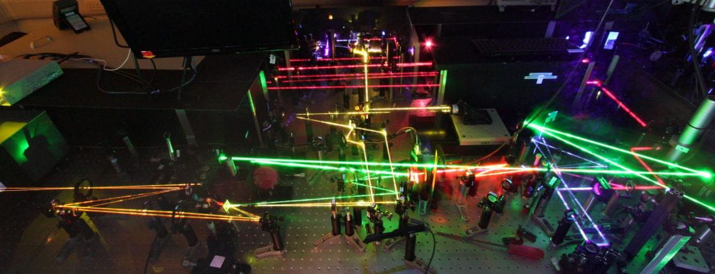 Multi-coloured laser beams on an optical table